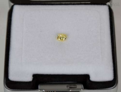 A yellow diamond with accompanying GIA certificate stating cushion modified brilliant cut, weight
