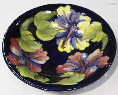 A Moorcroft pottery Hibiscus pattern bowl, 1970s, impressed marks and painted signature to base,