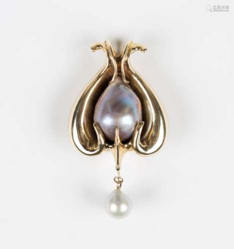 A gold and cultured pearl pendant of naturalistic scrolling design, mounted with a large grey tinted