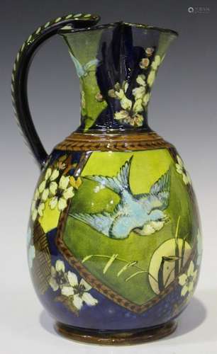 An Aesthetic Doulton Lambeth faience jug, circa 1881, decorated with panels of birds amongst