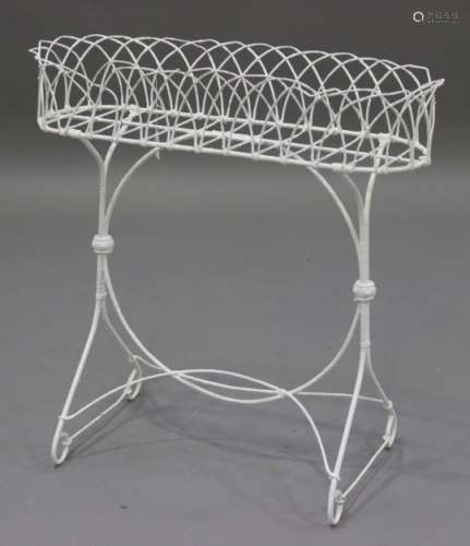 A late 19th century white painted wirework plant stand, on scrolling supports, height 72cm, width