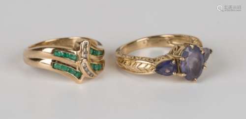 A 9ct gold, diamond and emerald ring, mounted with seven circular cut diamonds between circular