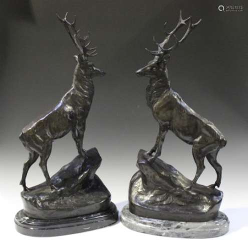 After Jules Moigniez - a pair of 20th century brown patinated cast bronze models of stags, both