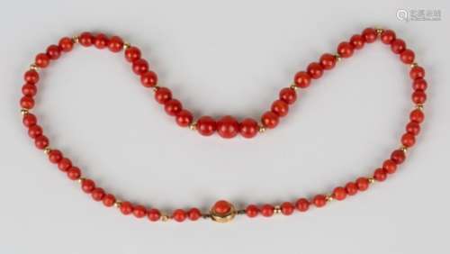 A single row necklace of graduated coral beads, spaced with gold beads, on a coral set gold clasp,
