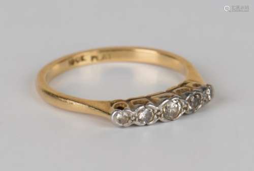 A gold, platinum and diamond five stone ring, mounted with a row of circular cut diamonds graduating