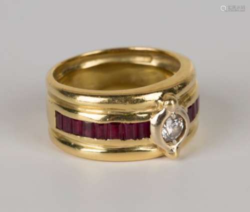 An 18ct gold, diamond and ruby ring, mounted with a circular cut diamond between baguette ruby set