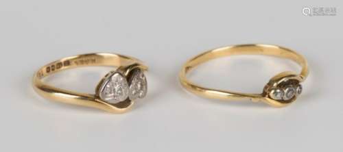 An 18ct gold and diamond two stone ring, designed as two hearts in a crossover design, Birmingham