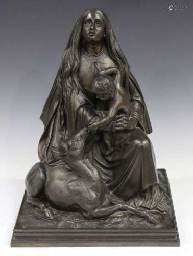 A 20th century German bronzed cast spelter figure group depicting the Madonna holding the Baby