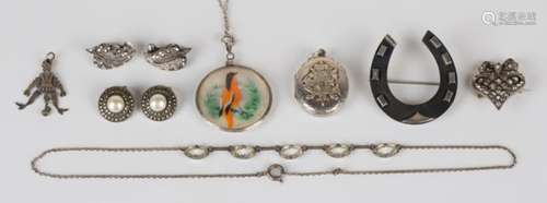 A group of mostly silver mounted jewellery, comprising two pairs of marcasite earclips, an oval