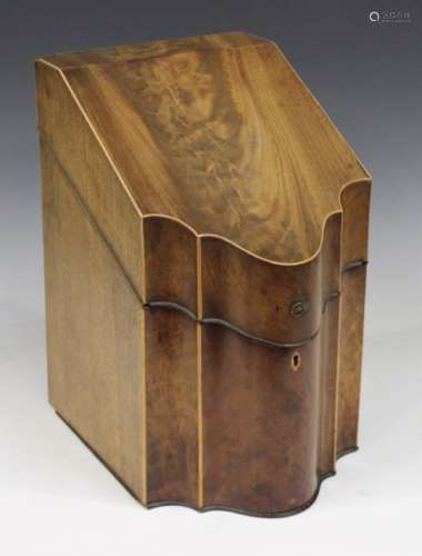 A George III mahogany cutlery box with boxwood stringing, the sloping lid above a serpentine