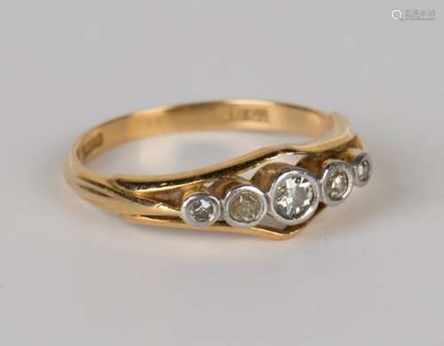 A gold and diamond five stone ring, collet set with a row of circular cut diamonds graduating in