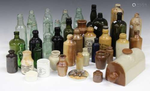 A mixed collection of 19th century stoneware and glass bottles, including ginger beer bottles, six