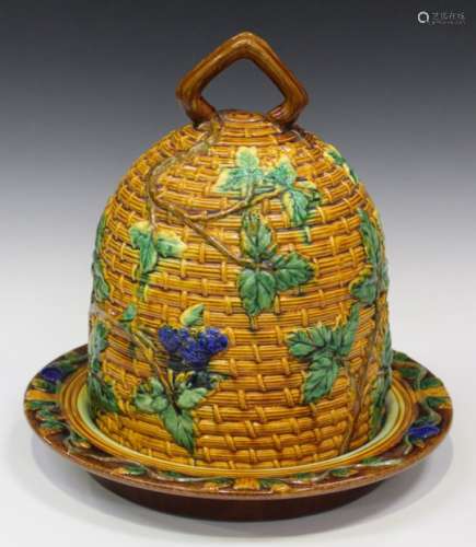 A majolica type cheese dome and stand in the style of Minton, late 20th century, the basketweave