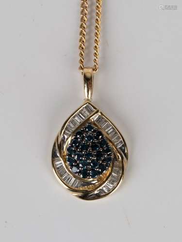 A gold, diamond and treated blue diamond drop shaped pendant, detailed '14K', length 2.7cm, with a