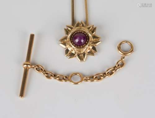 A gold and cabochon ruby pendant, designed as a stylized flowerhead, length 2.5cm, with a gold