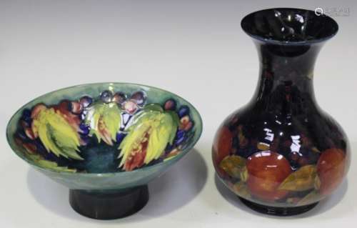 A Moorcroft pottery Pomegranate pattern vase, 1913-1925, height 20cm, together with a Moorcroft