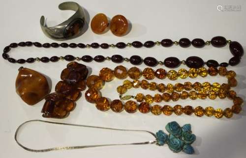 A group of reconstituted and simulated amber jewellery, comprising two bead necklaces, a pair of