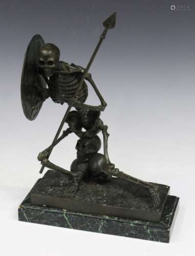 A modern brown patinated cast bronze figure of a skeleton warrior, holding a shield and a spear,
