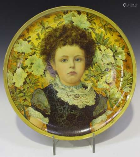 A faience pottery circular plaque, probably Doulton, late 19th century, decorated by J.H. McLennan