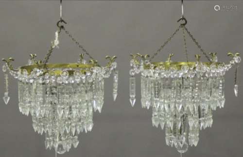 A pair of mid-20th century gilt metal and cut glass three-tier ceiling lights, the circlets with six