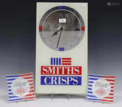 A mid/late 20th century glass Smiths Crisps advertising wall timepiece, the mirrored dial above