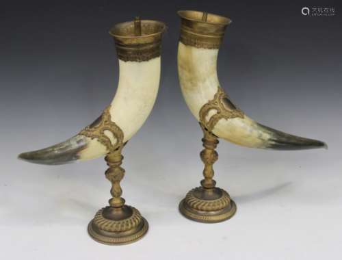 A pair of 20th century gilt metal mounted Highland cattle horn light fittings, each scrolling horn