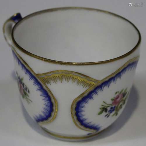 A Nicholas II St. Petersburg Russian porcelain cabinet cup, dated 1898, enamelled with floral