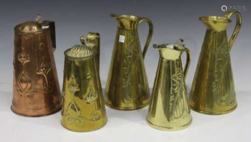 A group of five Art Nouveau embossed brass and copper jugs by Joseph Sankey & Sons, all bearing 'J S