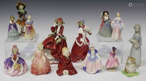 Twelve Royal Doulton porcelain figures, comprising Top o' the Hill, HN1834, Christmas Morn,