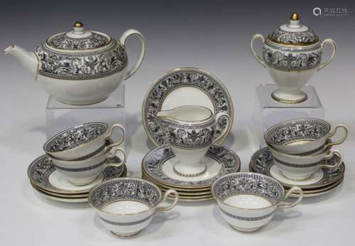 A Wedgwood black Florentine pattern part tea service, comprising teapot and cover, milk jug, sugar