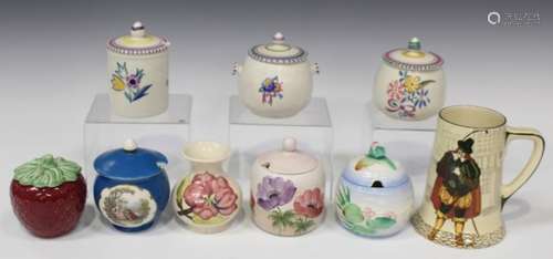 A small group of decorative ceramics, including a Moorcroft pink magnolia ivory ground vase,