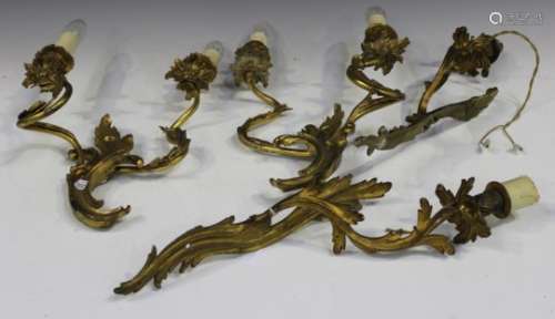 A pair of Rococo Revival cast ormolu two light wall sconces of scrolling foliate form, height