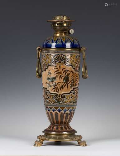 A Doulton Lambeth stoneware oil lamp, circa 1882, decorated by Eliza Simmance, monogrammed, the