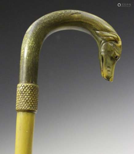 A late 19th century sectional horn walking stick, the handle probably carved from rhino horn, finely