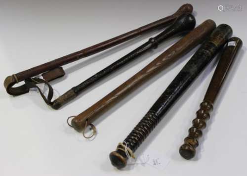 A Victorian painted wooden police truncheon, bearing a crowned 'V.R.' cypher and inscribed 'Police',