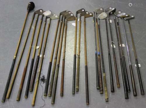 A selection of thirteen hickory shafted golf clubs, including a Cardinal Spade mashie, a J.H. Taylor