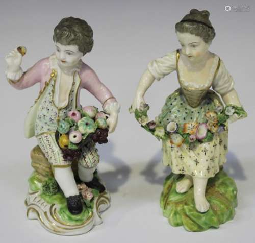 A matched pair of Derby porcelain figures, late 18th/early 19th century, modelled as a boy seated on