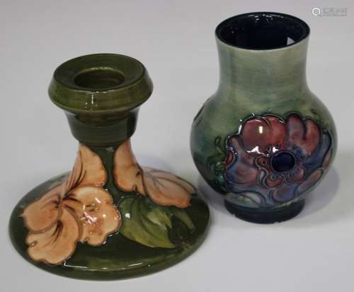 A Moorcroft pottery candlestick, circa 1968-80, decorated with Coral Hibiscus against a green