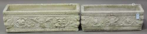 A graduated pair of 20th century cast composition stone garden troughs, each rectangular body cast