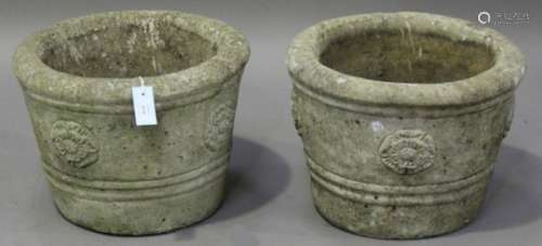 A pair of late 20th century cast composition stone garden urns of tapering circular form, the