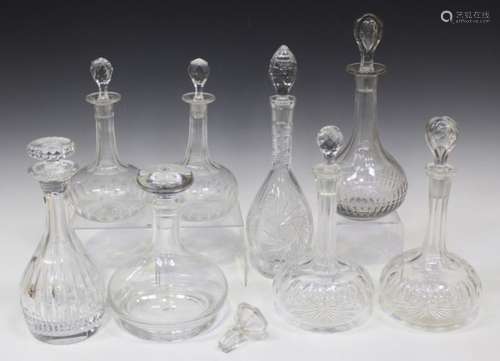 Eight clear glass decanters and nine stoppers, late 19th and 20th century, including a pair engraved