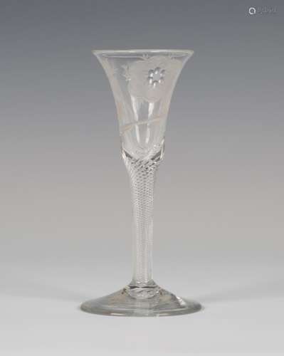 A Jacobite wine glass, mid-18th century, the gentle bell bowl engraved with a rose stem with a