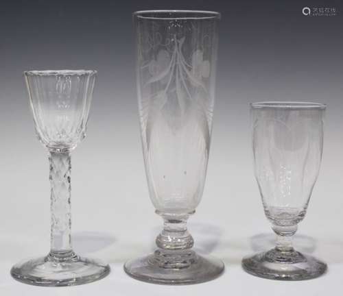 A faceted stem wine glass, circa 1785, the rounded funnel bowl cut with vertical facets above the