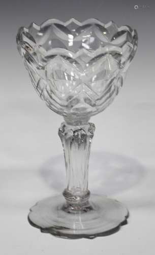 A moulded pedestal stem sweetmeat glass, circa 1780, the rounded bowl cut with circles and slices