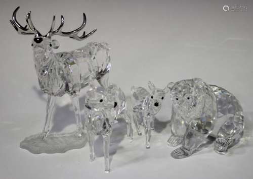 A Swarovski Crystal stag, designed by Adi Stocker, height 13.8cm, together with three further