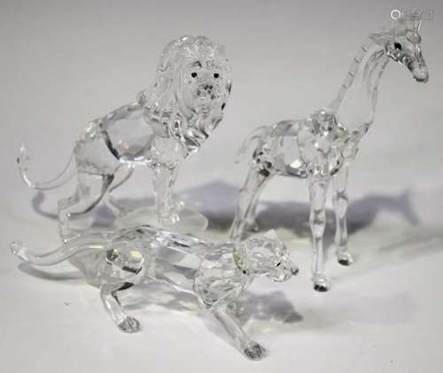 A Swarovski Crystal lion, designed by Martin Zendron, modelled standing on a rock, height 11.7cm,