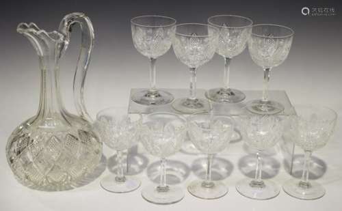 Thirteen cut wine glasses, 20th century, the rounded bowls with arched diamond cut panels