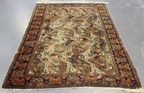 An Afshar rug, South-west Persia, early 20th century, the ivory field with overall bold stylized
