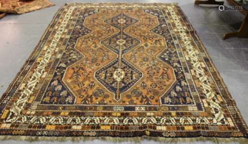 A Shiraz carpet, South-west Persia, early 20th century, the terracotta field with three linked