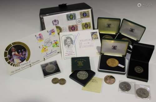 A group of three Royal Mint Fred Perry commemorative medallions, comprising two silver and one